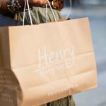 Image of a woman holding shopping bags - Beautiful shops for saree shopping in Mumbai