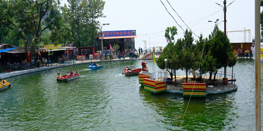 An image of people enjoying boating in a water park, one of the places to visit in vasai