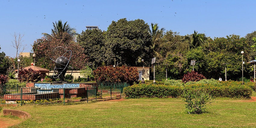 A serene park with lush greenery, walking paths, and seating areas for relaxation, one of he best places to visit in Vile Parle.
