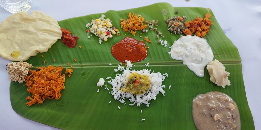 Authentic Coorg thali decorated on a banana leaf, one of the best things to do in Coorg