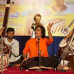 An image of a vibrant classic performance at the Sawai Gandharva Music Festival in Pune.