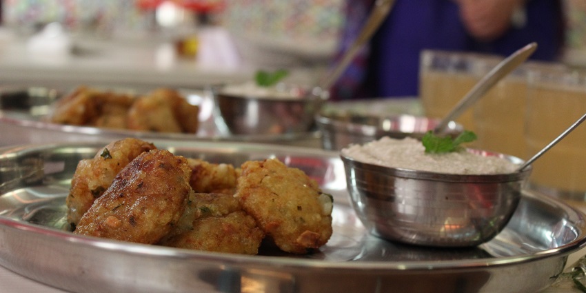 Sabudana vada, a dish made of Sago Pearls served on a plate accompanied by Coconut Chutney