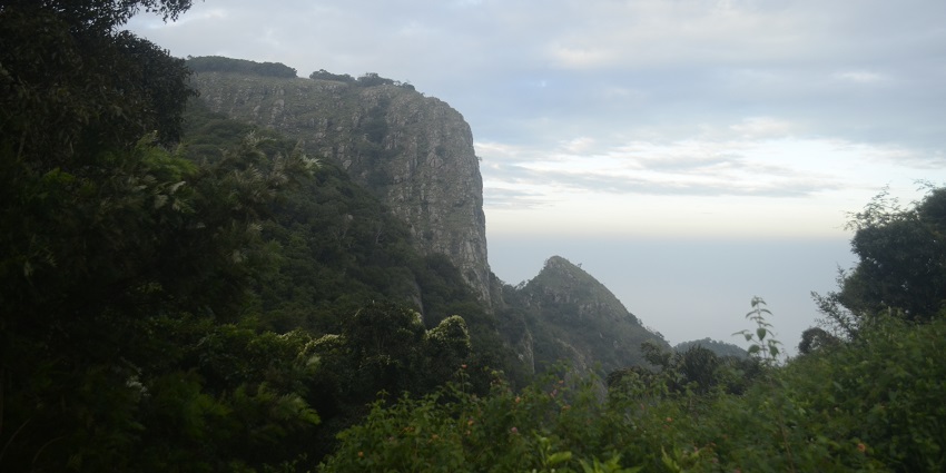 Enjoy views from the scenic Seeku Parai viewpoint near Puliyancholai Waterfalls