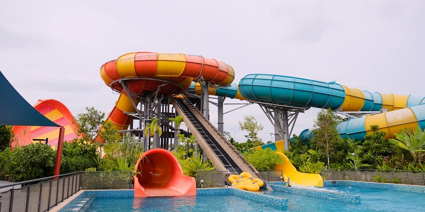 Image of a water park during day time - water slides and pool for fun with friends and family