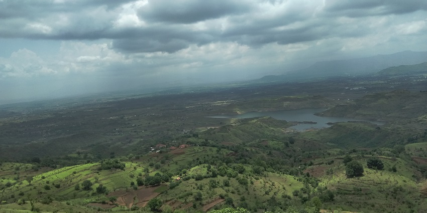 Panoramic view of Bhivpuri showcasing scenic hills with dense vegetation.