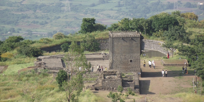 Aerial view of the iconic Shivneri Fort amidst the lush forest and hills in Maharashtra