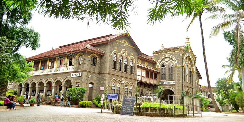 Gothic-style Fergusson College main building with arched entrance and historic charm