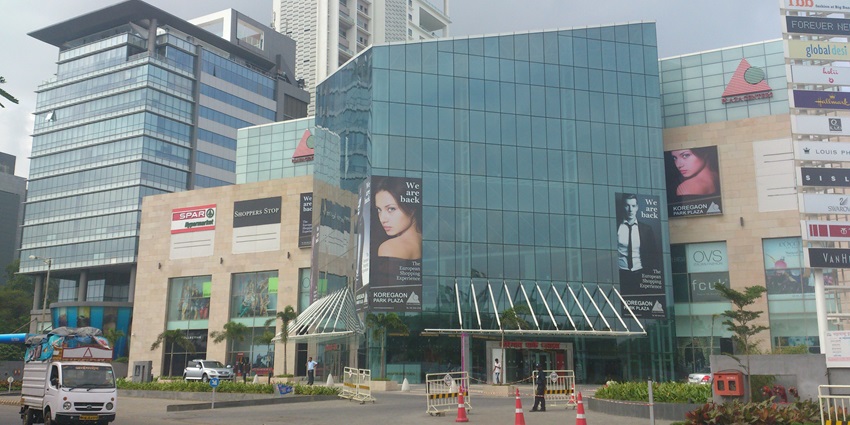 Colorful exterior of The Koregaon Park Plaza in Koregaon Park, a popular spot in Pune.