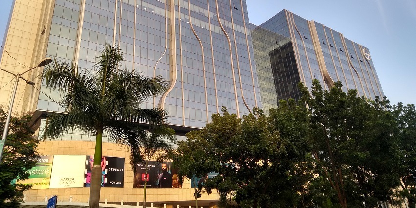 The exterior view of Grand Central Mall showcases vibrant shops and a spacious layout