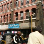 An image of a bustling road in Kolhapur captured during daytime for travellers