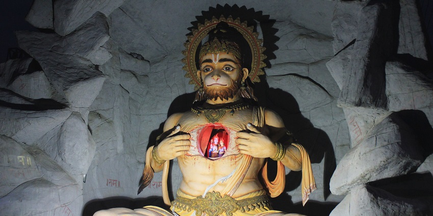 Lord Hanuman opens his chest to reveal images of Rama and Sita, symbolizing devotion.
