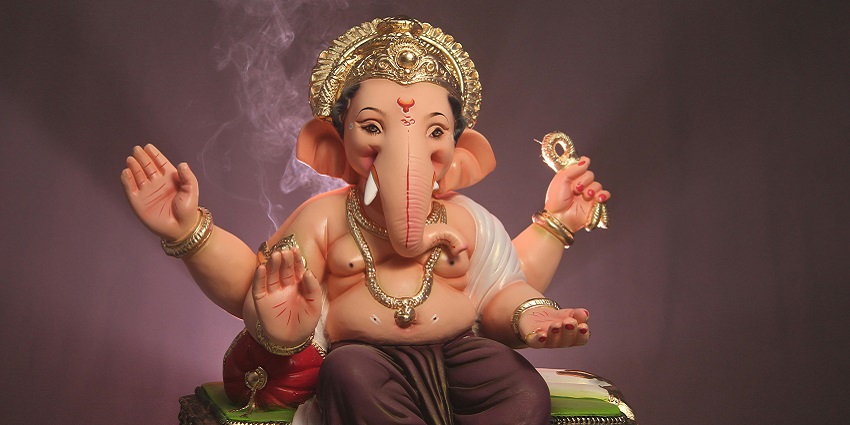 An inside view of the Shree Girijatmaj spiritual hub featuring a Lord Ganesha statue.