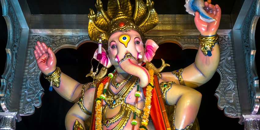 A glimpse of the majestic statue of Lord Ganesha adorned with beautiful colours.