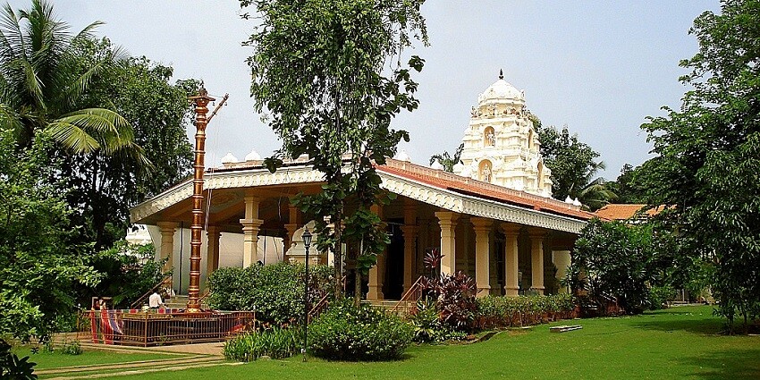 Mahaveer Jain temple standing on verdant gardens, offering a sight worth capturing