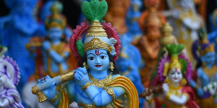 An inside view of a famous spiritual attraction in Maharashtra featuring statues of God.