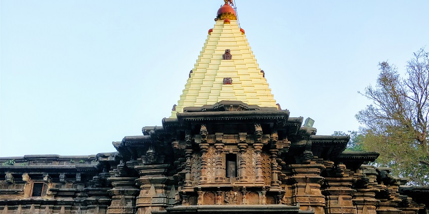 View of the Shree Shakuni Maruti Shani Temple against the clear blue sky in the backdrop