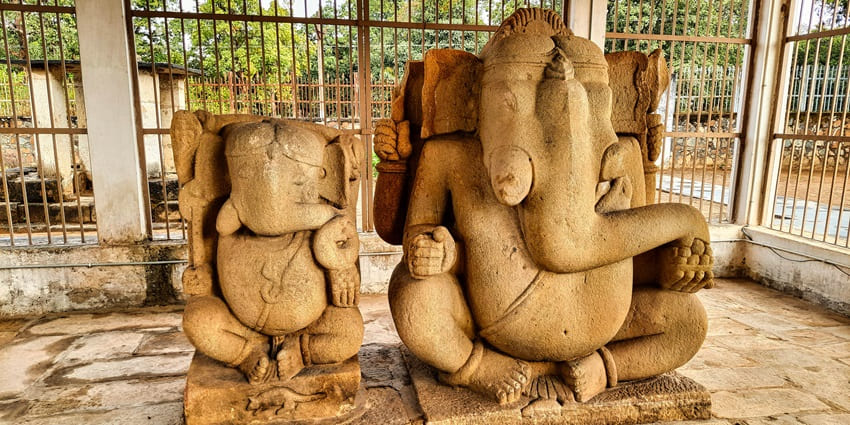 A sacred temple, one of the best places to visit in Diveagar, surrounded by coconut trees, known for its revered Ganesha idol.