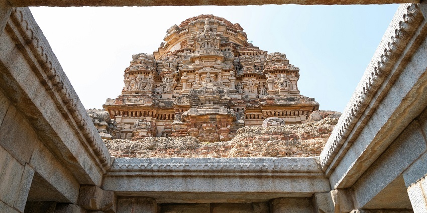 A picture taken at an ancient temple with intricate wall carvings and traditional architecture