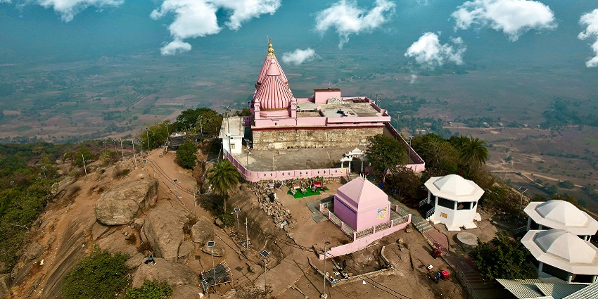 An aerial picture of a beautiful temple situated at a hilltop