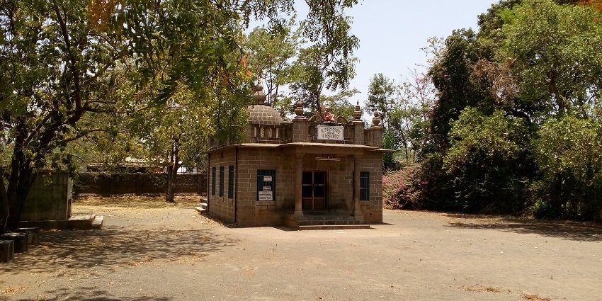 A picture of a small temple with traditional architecture