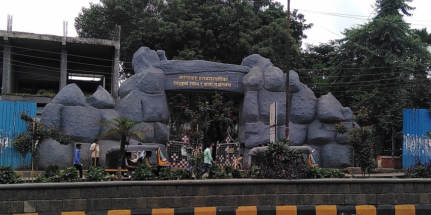 Visitors enjoying a wildlife experience at Gorewada Zoo, surrounded by a beautiful landscape.