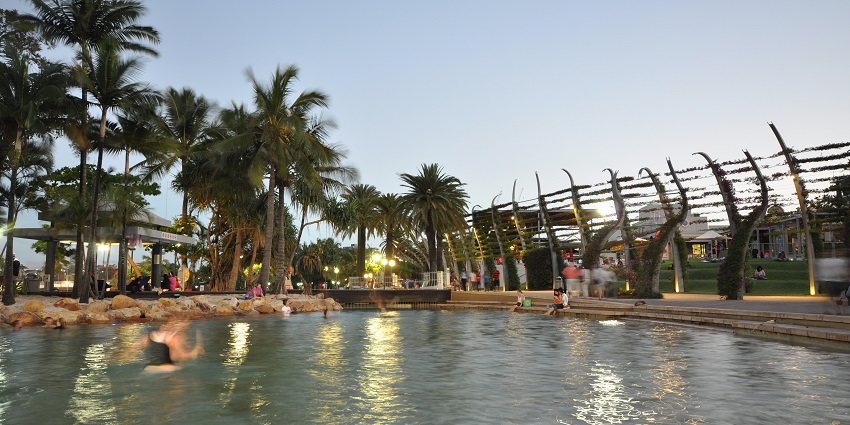 People hanging out at the pool of the resort in the daylight