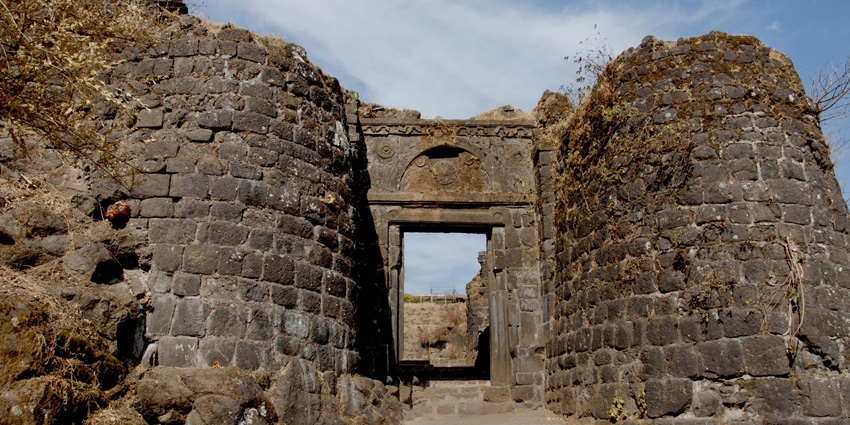 A glimpse of the iconic Sinhagad Fort exuding vintage charm and architectural beauty.