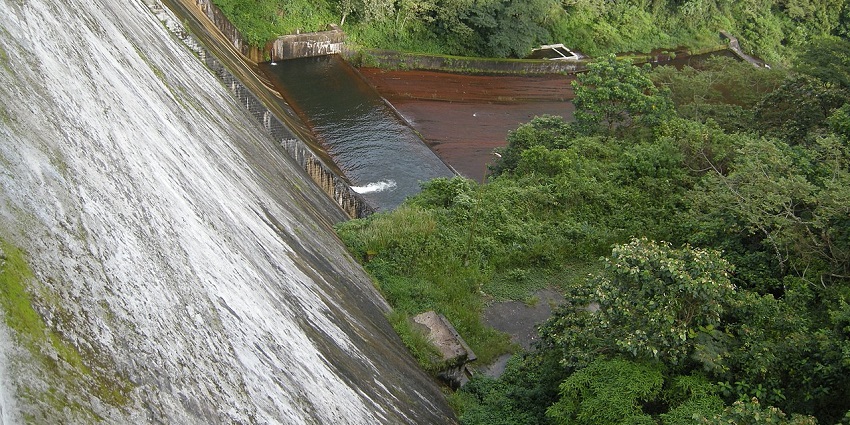 Places to visit near Coimbatore Tamil Nadu feature waterfalls with refreshing waters amidst lush forests.