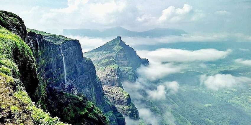 Aerial view of a waterfall, one of the best places near Toranmal Wildlife Sanctuary