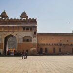 Gate of Sitabuldi Fort in Nagpur, Maharashtra, with a stone structure and clear sky.