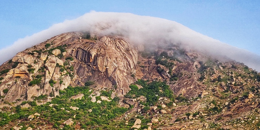 A view of the serene sunrise from Skandagiri Hills atop Kalavara Durga fort.