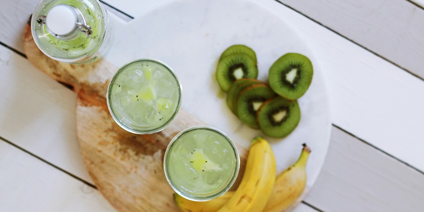 Image of fruit drinks served on glasses with Kiwi and banana on the side