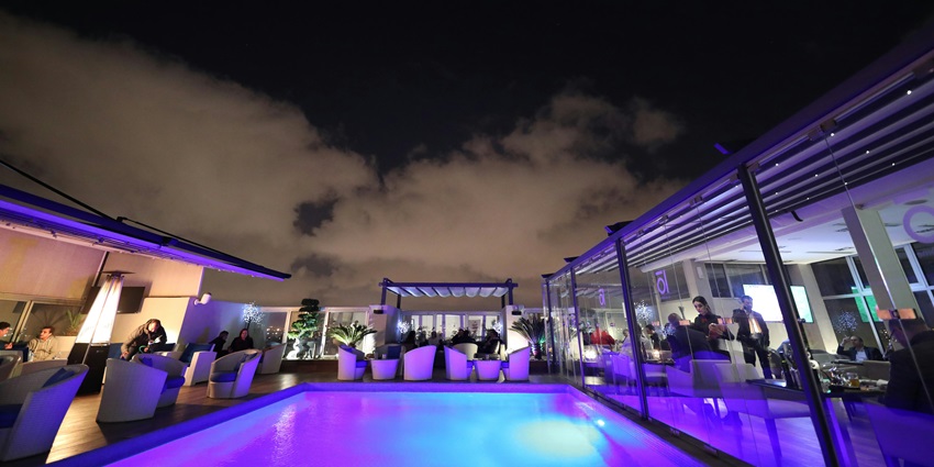 Image of a relaxing rooftop vibes with city views at Sky Grill Lounge & Bar