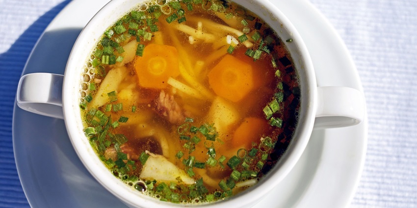An image of Skyu is a blend of soup and dough balls, a famous dish to try this trip.