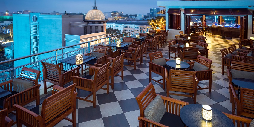 An interior view of Skyye Lounge featuring modern decor and vibrant lighting.