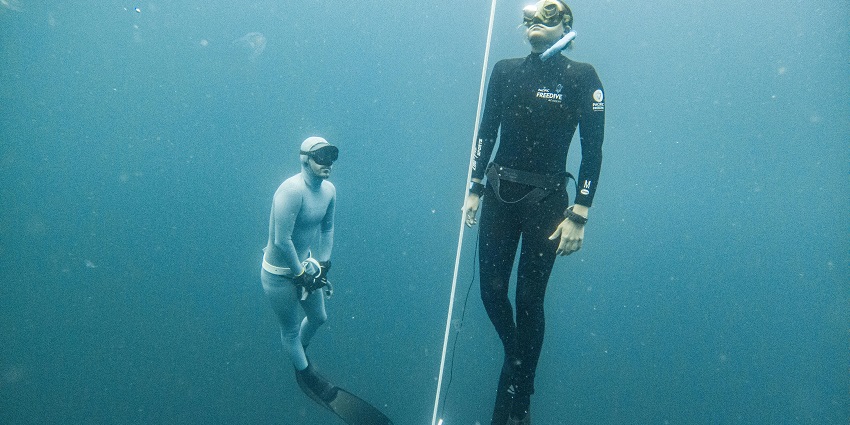 Snorkellers exploring underwater life, one of the best Mandwa Beach water sports.