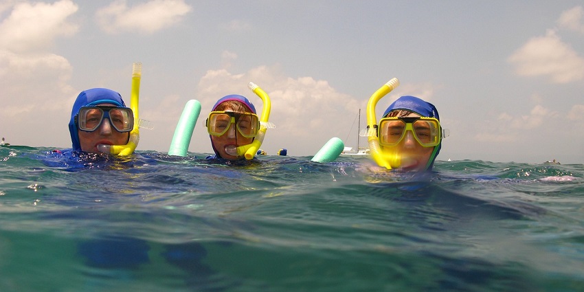 Two snorkellers exploring the crystal-clear waters of Koyna Lake, near Pune.