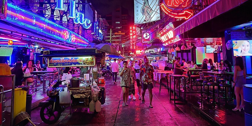 Neon-lit wonderland featuring lively bars and entertainment.
