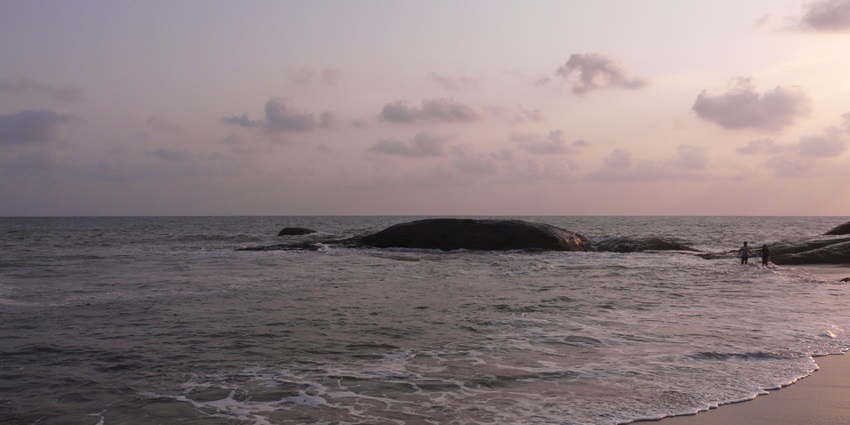 Rock-studded Someshwar Beach at Ullal, Mangalore, with golden sand and sunset glow