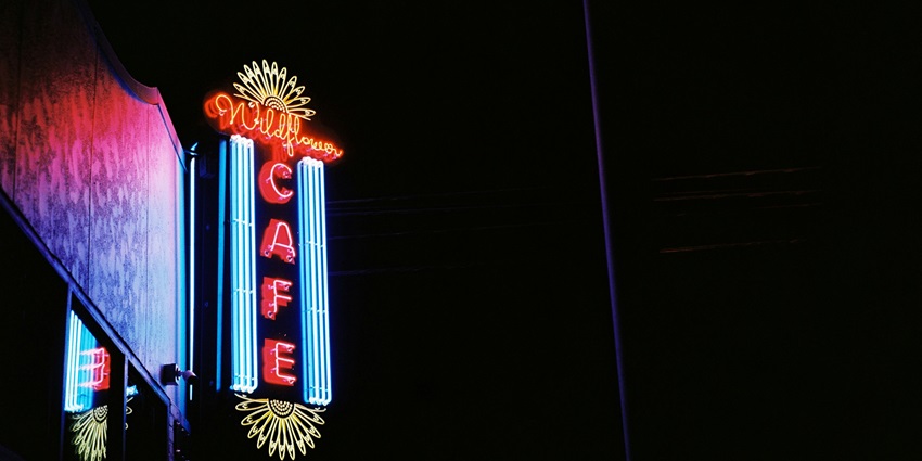 An idyllic view of Soro featuring majestic boards with neon sign lights and more.