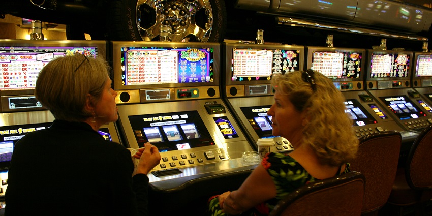 Players enjoying table games and slot machines at a casino in Charlotte NC.