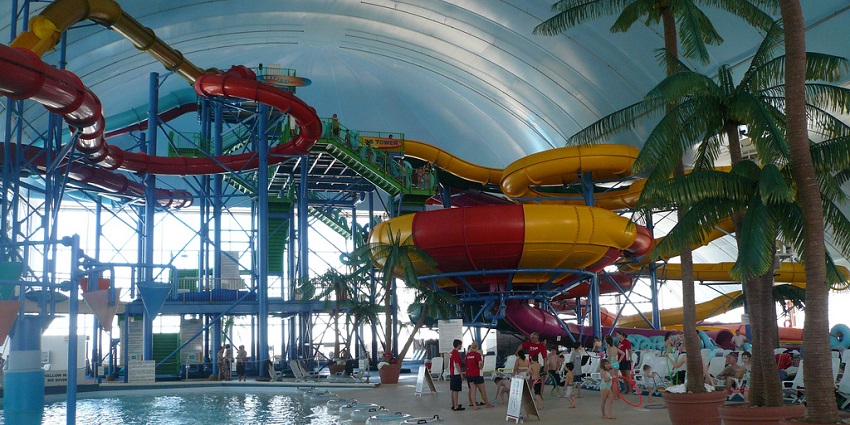 A lively scene at Water Kingdom with families enjoying water slides and pools