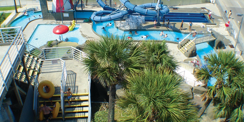Children and families enjoying water slides and attractions at Splash Water Park.