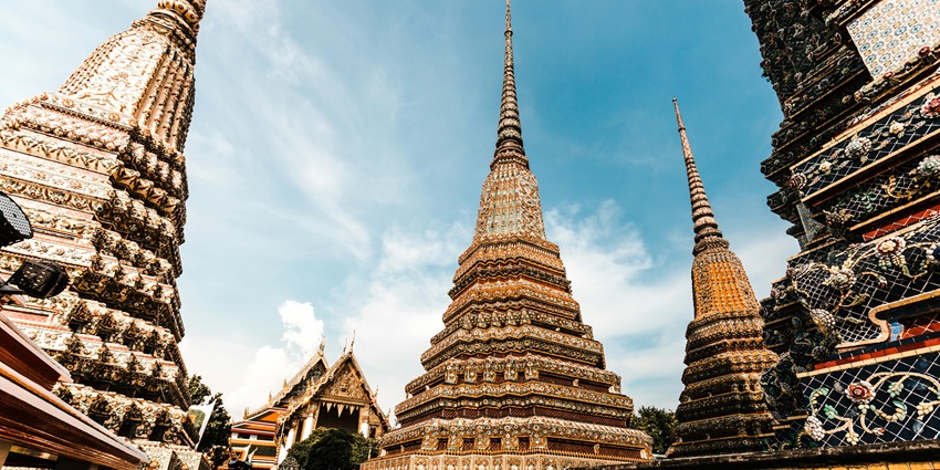 Pagodas during daytime with ornate details and a clear blue sky in the background