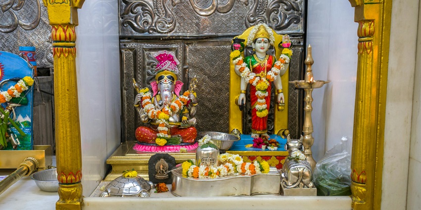 Beautiful idols of Lord Ganesha and Devi Parvati being worshipped at a Hindu temple