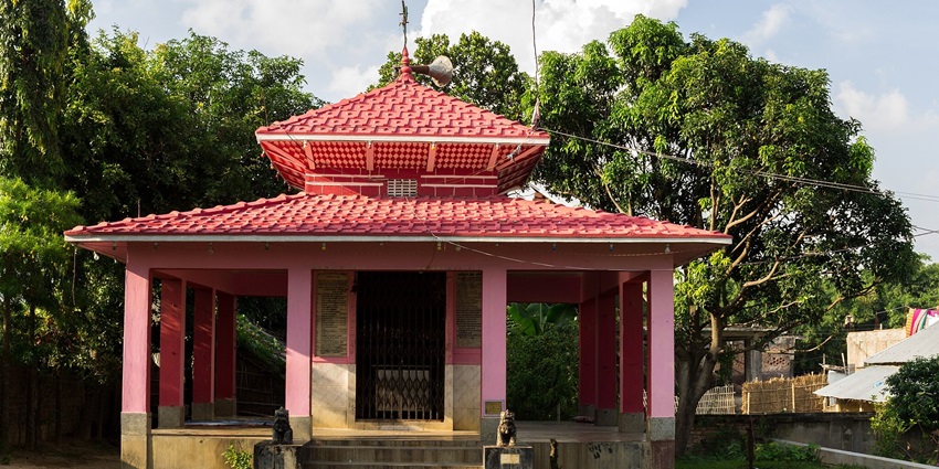 A temple with scenic views in the background.