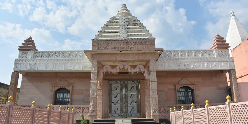 Wide angle view of the temple building against the clear blue sky