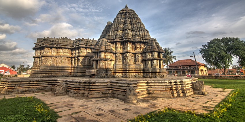A beautifully adorned Krishna temple with intricate carvings and a serene ambiance.