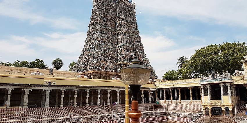 Stunning temple adorned with gold leaf and serene surroundings.
