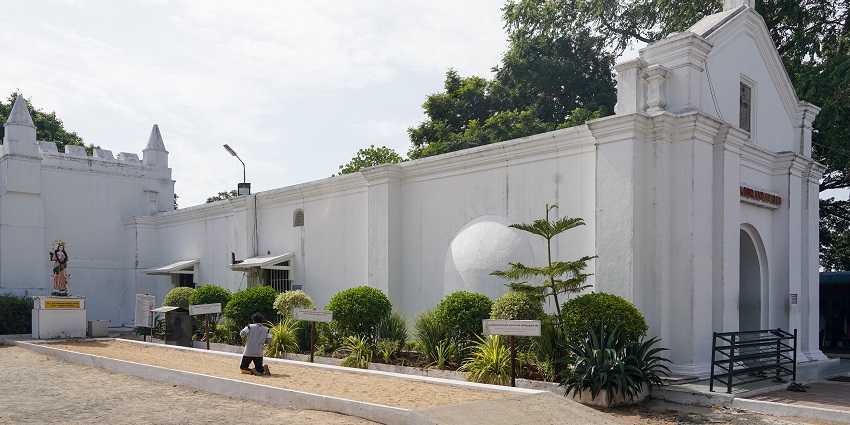 Entrance of St. Thomas Mount Church amidst lush greenery